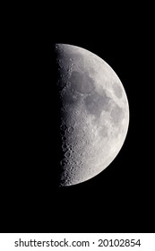 First quarter moon, photographed at the prime focus of a C5 telescope, with craters and surface details visible.