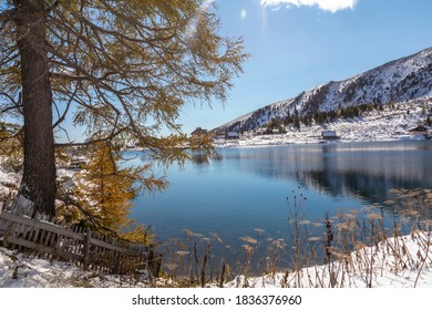 first snow in autumn on mountain lake named Falkertsee in Carinthia, Austria