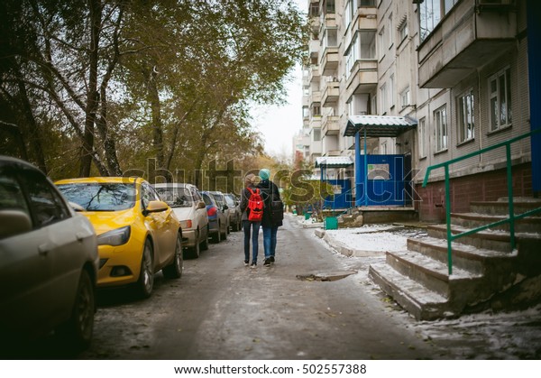 the first snow in the city. car under snow,\
snow-covered streets of the\
city