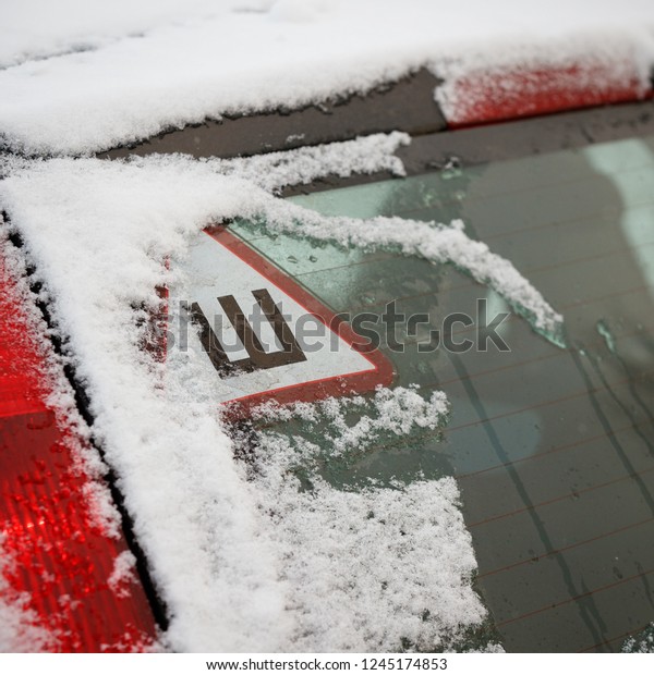 The first snow on
the car. Warning sign 