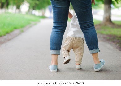 First steps with mother's help - Powered by Shutterstock