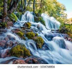 First Sunlight Lights Up The Pure Water Waterfall On Plitvice National Park. Colorful Spring Scene Of Green Forest With Blue Lake. Great Countryside View Of Croatia, Europe. 