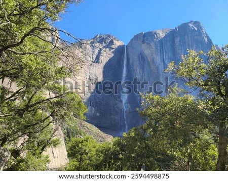 First view of Upper Yosemite falls on the trail in Yosemite National Park, California