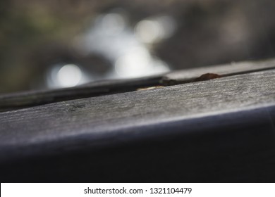 The First Winter Frost Is Already On The Railing. Close-up. In The Forest Background. Winter Is Knocking On The Door. Cold Weather. Period Of Illness And Increased Number Of Injuries.