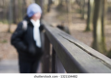 The First Winter Frost Is Already On The Railing. Close-up. In The Forest Background. People. Winter Is Knocking On The Door. Cold Weather. Period Of Illness And Increased Number Of Injuries.