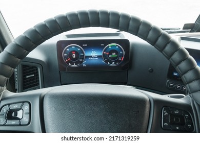 First-person View Behind The Wheel Of A Truck. View From The Cab Of The Truck. Touch-sensitive Instrument Panel. Multi-steering Wheel. Details Of The Cabin Interior. AdBlue Technology