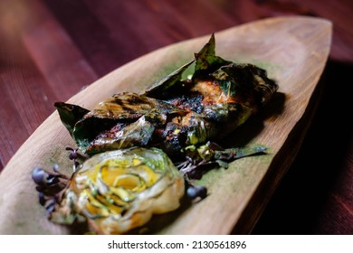 Fish Baked In Bamboo Leaves. Seafood Dish Side View.