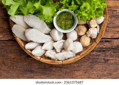 Fish balls with Thai seafood dipping sauce recipe and salad vegetables on wood background, Asian food, Street food, Thai food. - Powered by Shutterstock