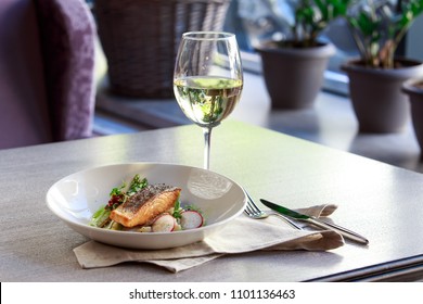 A Fish With The Bottle Of White Wine