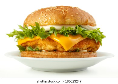 Fish Burger With Cheese And Mayonnaise On Dish, White Background