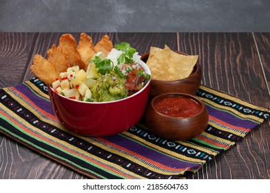 Fish Burrito Bowl With Nachos And Chili Sauce Served In A Dish Isolated On Mat Side View Of Fastfood On Wooden Background