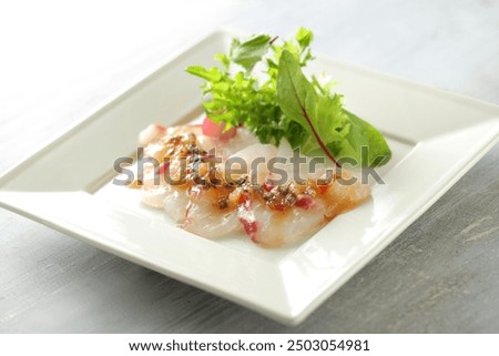 Fish carpaccio is a typical example of a Western dish with a Japanese twist.
