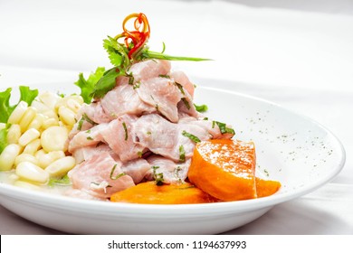 Fish Ceviche With Corn And Sweet Potato With Lettuce Salad On White Background