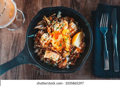 Fish And Chips In Cast Iron Skillet Viewed Directly From Above