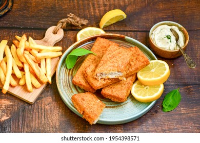  Fish And Chips .Close Up Of   Crispy Breaded  Deep Fried Fish Fingers With Breadcrumbs Served With Remoulade Sauce And  Lemon