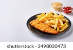 Fish and chips is a hot dish of fried fish in batter, served with chips or french fries.  Malt vinegar, ketchup,  catsup, tartar sauce are common dipping sauces.  isolated on white background