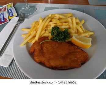 fish and chips on a white plate