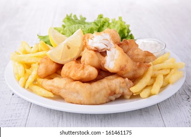 Fish And Chips With Salad And Sauce