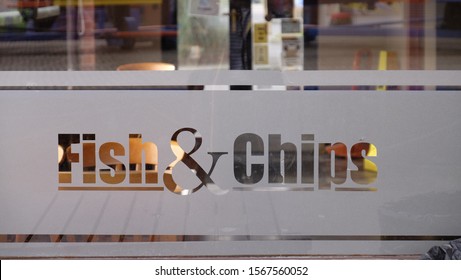 fish and chips sign etched on glass window