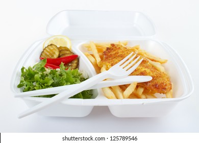 Fish And Chips Takeout Food In Plastic Box With Disposable Fork And Knife