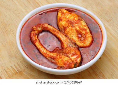 fish curry ,indian food,fish curry on wood bowl