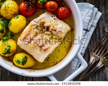 Similar – Image, Stock Photo Cod fillet with lemon slices and herbs