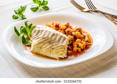 Fish Dish - Fried Cod Fillet With Fresh Fruit Salsa On White Table 