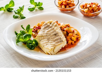 Fish Dish - Fried Cod Fillet With Fresh Fruit Salsa On White Table 