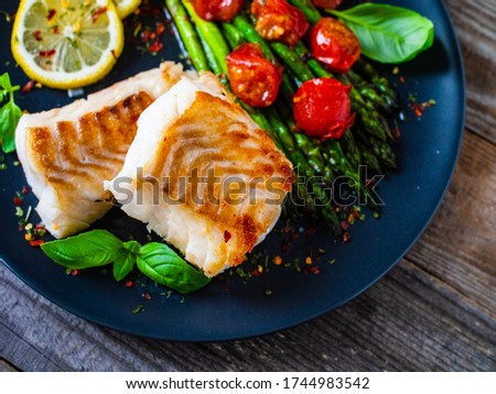 Similar – Image, Stock Photo Cod fillet with lemon slices and herbs