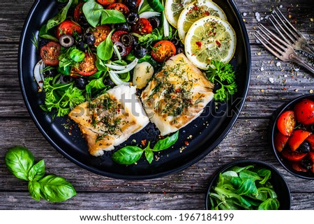 Similar – Image, Stock Photo Cod fillet with lemon slices and herbs