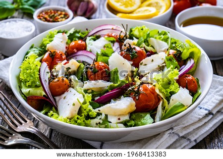 Similar – Image, Stock Photo Cod fillet with lemon slices and herbs