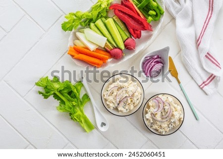 Fish and egg paste or salad with raw snack vegetables, healthy snack