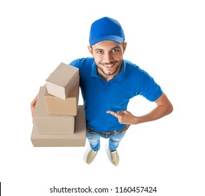 Fish Eye Shot Of Delivery Man Shows On Boxes In His Hand Isolated On White Background