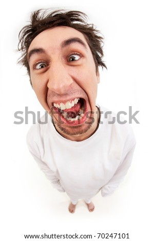 Fish eye shot of screaming insane man in strait-jacket in isolation