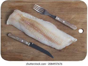 Fish Fillet, Knife And Fork On The Wooden Board, View From Above