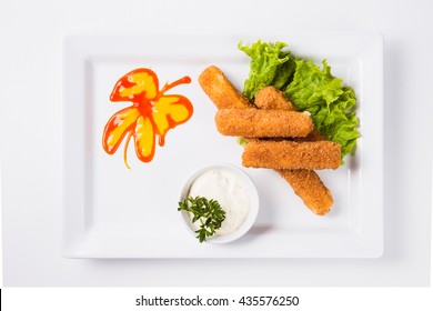 Fish Fingers With Sauce On A Plate On A White Background (top View)