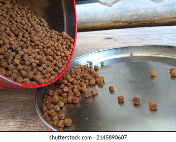 Fish Food In The Form Of Pellets In Cans