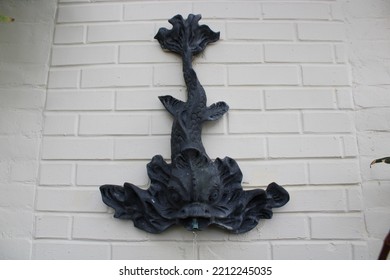 Fish Fountain Mounted On A Wall. 