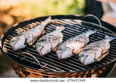 Fish Fried On The Grill Outdoor. Spanish Cuisine
