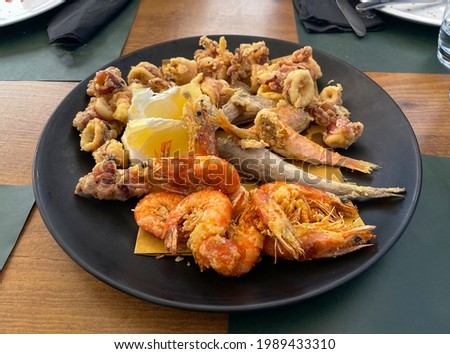 Fish fry dish with squid, shrimp, small octopus and cod