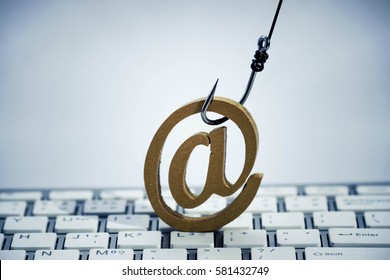 A Fish Hook With Email Sign On  Computer Keyboard / Email Phishing Attack Concept