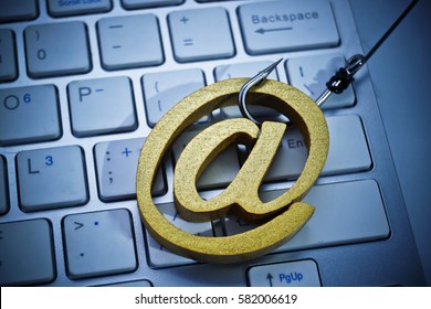 A Fish Hook With Email Sign On  Computer Keyboard / Email Phishing Attack Concept