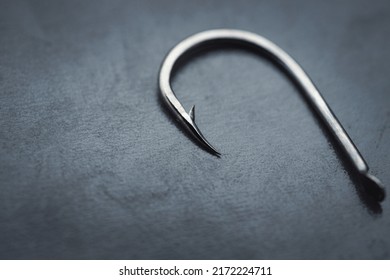 Fish hook on a black background, close-up - Powered by Shutterstock