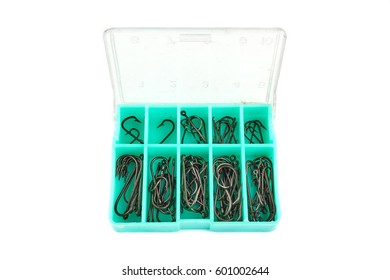 Fish hooks in a box of different sizes on a white isolated background