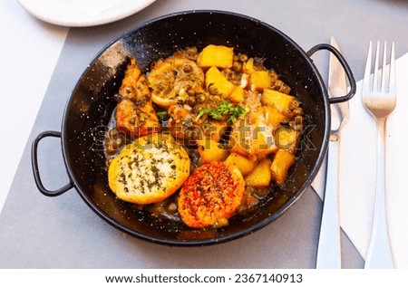 Fish in lemon sauce - dish of Valencian cuisine. High quality photo