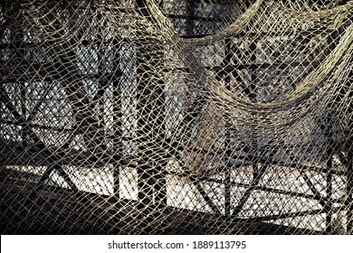 Fish Net Vintage Background. Fishing Net Abstract Texture With Knotted Pattern. Old Fishnet Wallpaper. Design Element With Retro Fish Net. Fishnet And Iron Framing Abstract Grunge Design Detail.