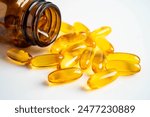 Fish oil capsules omega 3 vitamin with EPA and DHAvon white background.