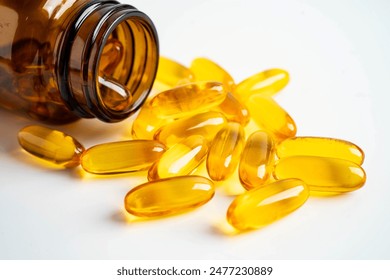 Fish oil capsules omega 3 vitamin with EPA and DHAvon white background. - Powered by Shutterstock