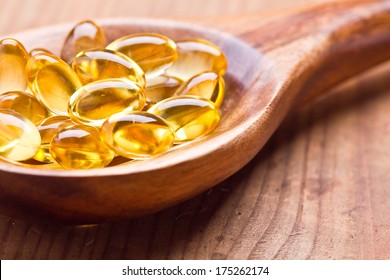 Fish Oil Capsules In A Spoon 