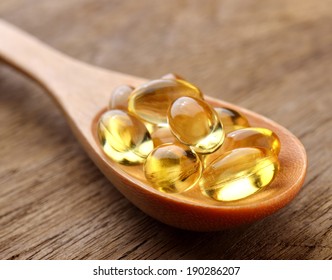 Fish Oil Capsules In A Spoon